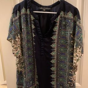 Flowy patterned shirt.